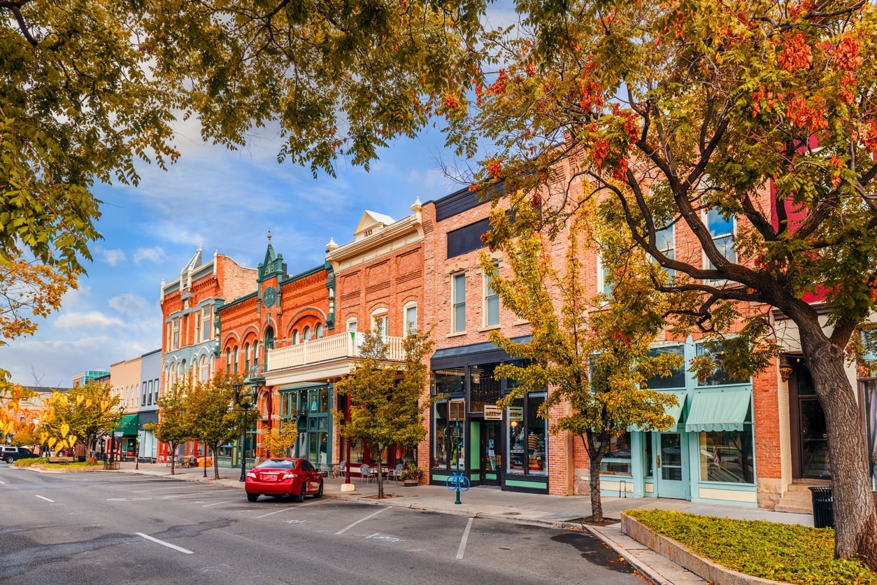 A historic downtown main street with brick storefronts in one of the best cities for young professionals