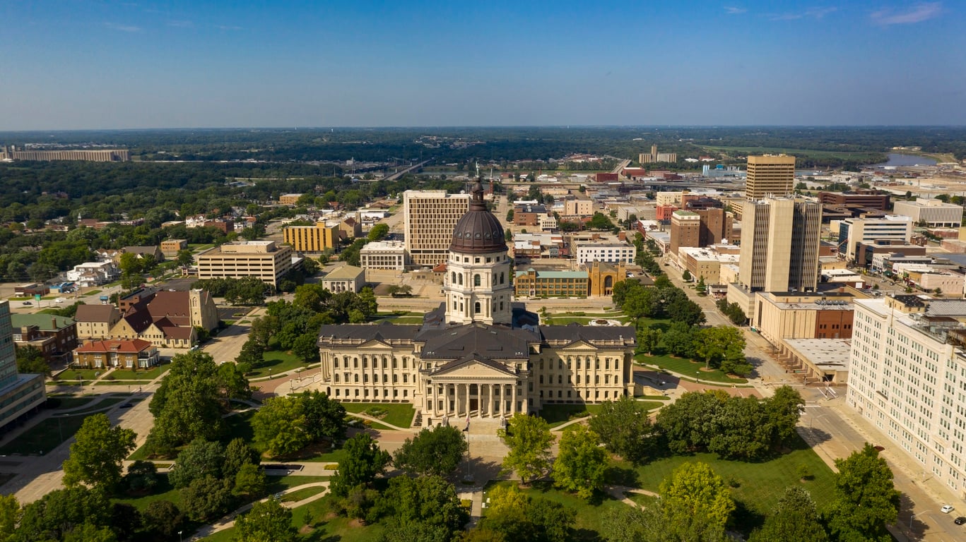 An aerial skyline view of Topeka, Kansas, one of the best cities for moving without a job